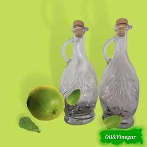 Pair of embrossed glass cruets, leaves design, 6 ½” tall, cork stoppers.